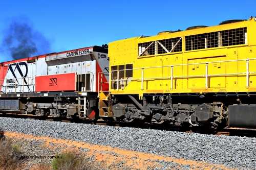 240328 2906
Feysville, Mineral Resources empty Mount Walton iron ore train 5040 with mid-train units Q 4003 and MRL 005 'Carina Flyer' view of the differing radiator sections on the EMD GT46C [Q 4003] and the GE C44ACi [MRL 005]. March 28, 2024.
Keywords: Q-class;Q4003;Clyde-Engineering-Forrestfield-WA;EMD;GT46C;97-1456;Q303;