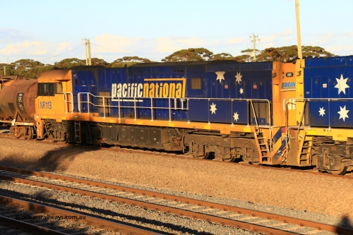 240328 3168
West Kalgoorlie yard and empty Pacific National fuel train 5445 to Esperance waits for departure time with second unit Goninan WA built GE model Cv40-9i NR class unit NR 113, serial number 7250-09 / 97-312 with thirty-one tanks for 705.7 tonnes and 607.4 metres. March 28, 2024.
Keywords: NR-class;NR113;Goninan-WA;GE;Cv40-9i;7250-09/97-312;