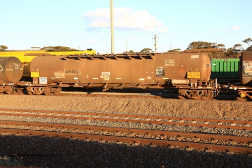 240328 3174
West Kalgoorlie, Viva Energy's ATPF 584 fuel tank waggon, built by Westrail Midland Workshops in 1980 as the final Shell WJP type 80.66 kL one compartment one dome tank. Original code and Shell Fleet No. TR 719 still visible, fitted with type F InterLock couplers, 80,500 SFL [safe fill level], on Pacific National's train 5445 empty fuel to Esperance. March 28, 2024.
Keywords: ATPF-type;ATPF584;Westrail-Midland-WS;WJP-type;