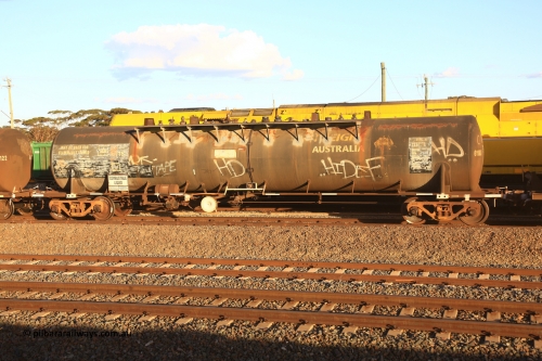 240328 3175
West Kalgoorlie, Viva Energy's NTBF type fuel tank waggon NTBF 6118, with former owners name (Freight Australia) visible. Originally built by Comeng NSW in 1975 as an SCA type 69,000 litre bitumen tanker SCA 267 for Shell NSW. Old code NTAF 6118 U is also visible with conventional couplers, Pacific National's 5445 empty fuel train to Esperance. March 28.2024.
Keywords: NTBF-type;NTBF6118;Comeng-NSW;SCA-type;SCA267;NTAF-type;
