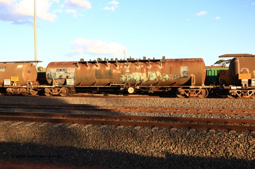 240328 3185
West Kalgoorlie, Viva Energy's NTBF type fuel tank waggon NTBF 6119, with a leading zero added, originally built by Comeng NSW in 1975 as SCA type SCA 270 a 69,000 litre bitumen tanker for Shell NSW, diesel capacity of 62,700 litres. Freight Australia painted out in middle of tank, normal E type couplers and old NTAF 6119 G number visible. Pacific National empty fuel train 5445 to Esperance. March 28, 2024.
Keywords: NTBF-type;NTBF6119;Comeng-NSW;SCA-type;SCA270;
