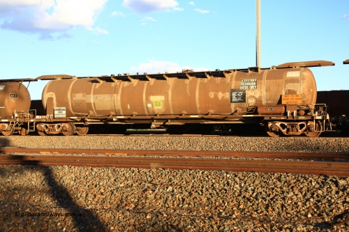 240328 3191
West Kalgoorlie, Viva Energy's APTF type fuel tank waggon ATPF 581 built by WAGR Midland Workshops in 1976 for Shell, in a batch of three, as a WJP type 80,660 litre, one compartment one dome tank waggon, with a SFL of 80,500 litres, fitted with type F InterLock couplers. Pacific National empty fuel train 5445 to Esperance. March 28, 2024.
Keywords: ATPF-type;ATPF581;WAGR-Midland-WS;WJP-type;