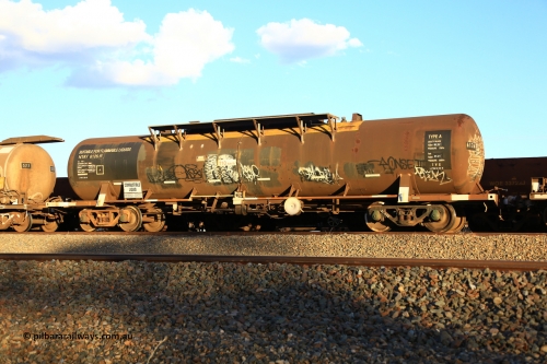 240328 3197
West Kalgoorlie, Viva Energy's NTAY type fuel tank waggon NTAY 6126 built by Indeng, Qld in 1976, in a batch of four, for Shell as an SCA type 65,000 litre one compartment oil tank SCA 277. Recoded to NTAF 277, then NTAF 6126. Diesel capacity of 61,300 litres. Freight Australia painted out in middle of tank and fitted with conventional couplers. Pacific National empty fuel train 5445 to Esperance. March 28, 2024.
Keywords: NTAY-type;NTAY6126;Indeng-Qld;SCA-type;SCA277;NTAF-type;