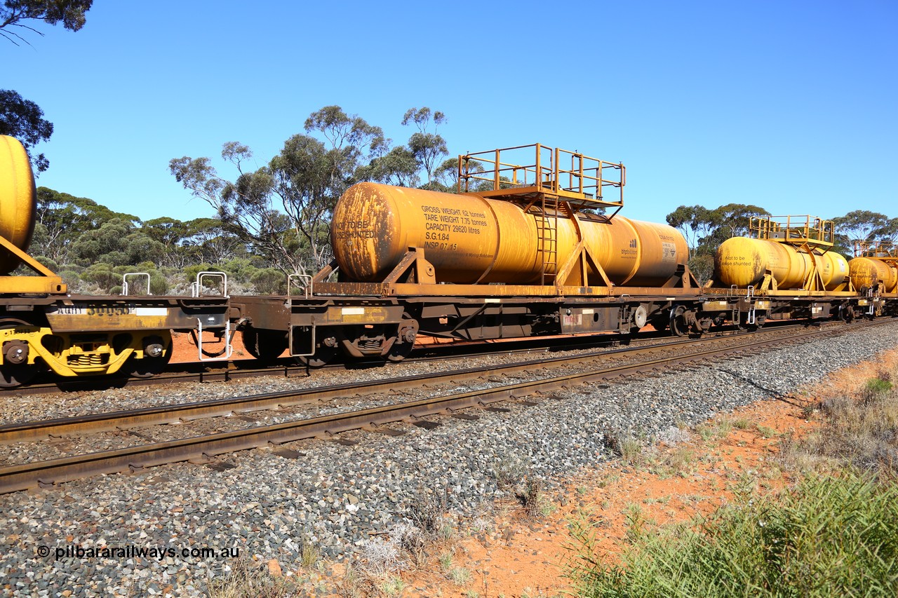 161112 3455
Binduli, loaded Hampton acid train 7406 with AQHY 30082 with sulphuric acid tank CSA 0112, originally built by the WAGR Midland Workshops in 1964/66 as a WF type flat waggon, then in 1997, following several recodes and modifications, was one of seventy five waggons converted to the WQH type to carry CSA sulphuric acid tanks between Hampton/Kalgoorlie and Perth/Kwinana. CSA 0112 was built by Vcare Engineering, India for Access Petrotec & Mining Solutions.
Keywords: AQHY-type;AQHY30082;WAGR-Midland-WS;WF-type;WFP-type;WFDY-type;WFDF-type;RFDF-type;WQH-type;