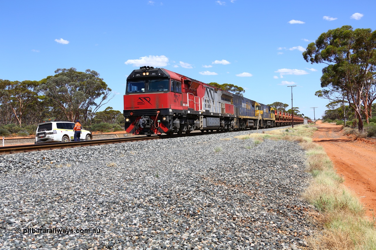 190107 0521
Binduli, following a crew change Mineral Resources empty iron ore train 2034 with Mineral Resources MRL class loco MRL 003 'Southern Cross' with serial R-0113-03/14-506 a UGL Rail Broadmeadow NSW built GE model C44ACi model leads two Pacific National NR class units NR 43 and NR 78 with 53 pairs of MHPYs and 2 single MHLY bottom discharge hopper waggons for 1293 metres and 2258 tonnes.
Keywords: MRL-class;MRL003;UGL-Rail-NSW;GE;C44ACi;R-0113-03/14-506;