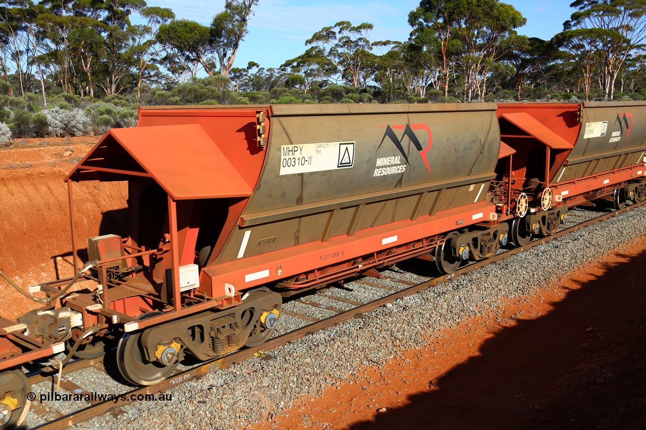 190109 1663
Binduli, Mineral Resources Ltd empty iron ore train 4030 with MRL's MHPY type iron ore waggon MHPY 00310 built by CSR Yangtze Co China serial 2014/382-310 in 2014 as a batch of 382 units, these bottom discharge hopper waggons are operated in 'married' pairs.
Keywords: MHPY-type;MHPY00310;2014/382-310;CSR-Yangtze-Co-China;