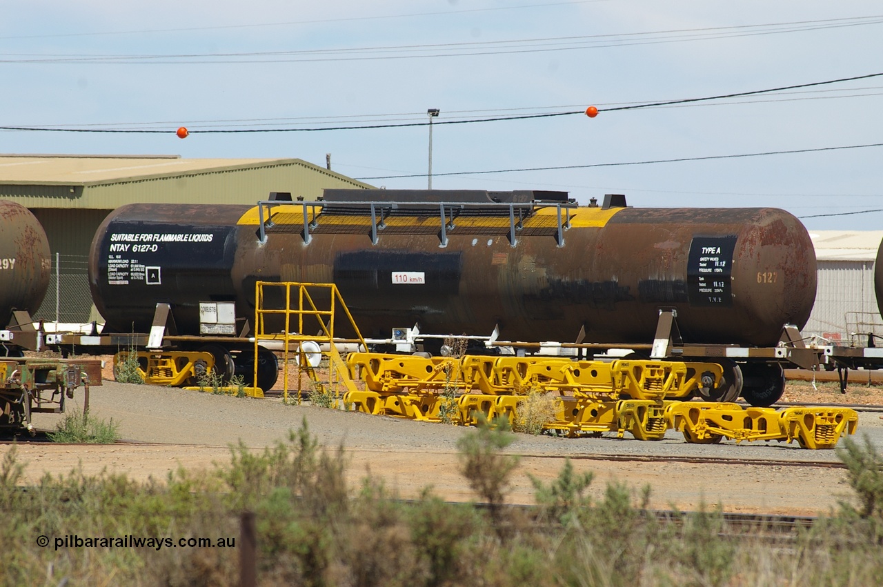 121202 IMG P11608
West Kalgoorlie, NTAY 6127 fuel tank waggon, built by Industrial Engineering Qld in 1976 as an SCA type SCA 278 for Shell. Recoded to NTAF 278, then 6127, capacity of 61,300 litres. Peter Donaghy image.
Keywords: Peter-D-Image;NTAY-type;NTAY6127;Indeng-Qld;SCA-type;SCA278;NTAF-type;