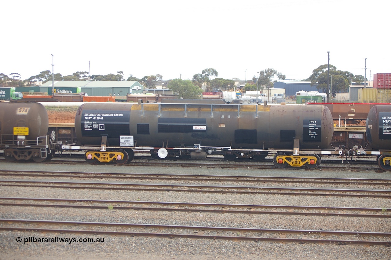 121210 IMG P11780
West Kalgoorlie, NTAY 6128 fuel tank waggon, built by Indeng Qld 1976 for Shell as an SCA type SCA 279, recoded to NTAF 279 then 6128. Capacity of 61,300 litres. Peter Donaghy image.
Keywords: Peter-D-Image;NTAY-type;NTAY6128;Indeng-Qld;SCA-type;SCA279;NTAF-type;