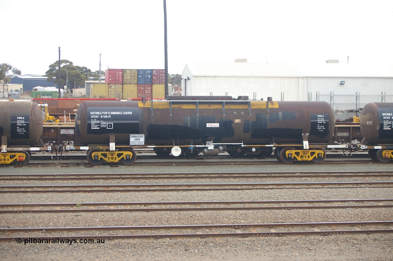 121210 IMG P11781
West Kalgoorlie, NTAY 6126 fuel tank waggon, built by Indeng Qld 1976 for Shell as an SCA type SCA 277. Recoded to NTAF 277, then 6126. Capacity of 61,300 litres. Peter Donaghy image.
Keywords: Peter-D-Image;NTAY-type;NTAY6126;Indeng-Qld;SCA-type;SCA277;NTAF-type;