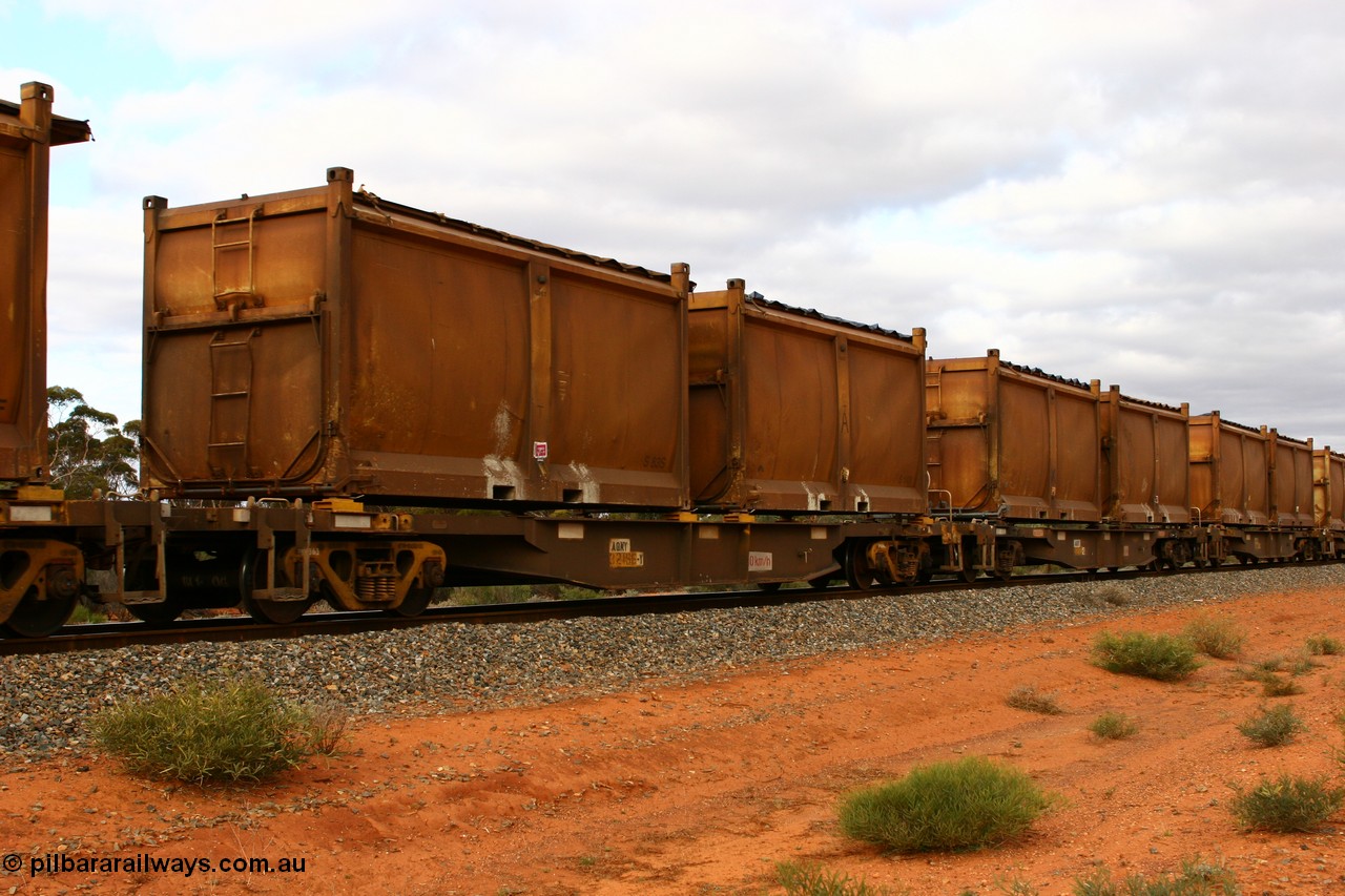 060527 4104
Scotia, AQNY 32166, one of sixty two waggons built by Goninan WA in 1998 as WQN type for Murrin Murrin container traffic, with sulphur skips S83S and S14R both with original style doors and sliding tarpaulins, train 6029 loaded Malcolm freighter.
Keywords: AQNY-type;AQNY32166;Goninan-WA;WQN-type;