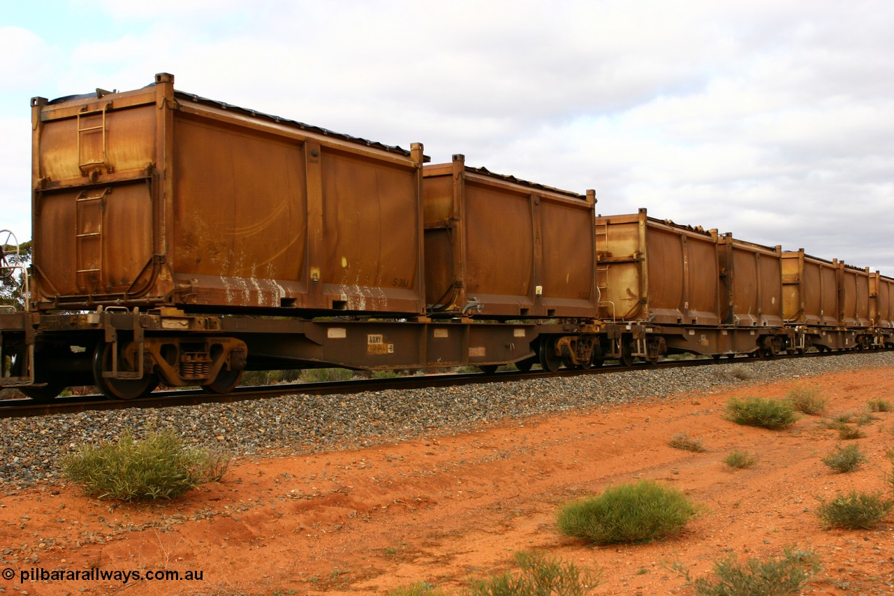 060527 4106
Scotia, AQNY 32204, one of sixty two waggons built by Goninan WA in 1998 as WQN type for Murrin Murrin container traffic, with sulphur skips S39J and S31G both with original style doors and sliding tarpaulins, train 6029 loaded Malcolm freighter.
Keywords: AQNY-type;AQNY32204;Goninan-WA;WQN-type;