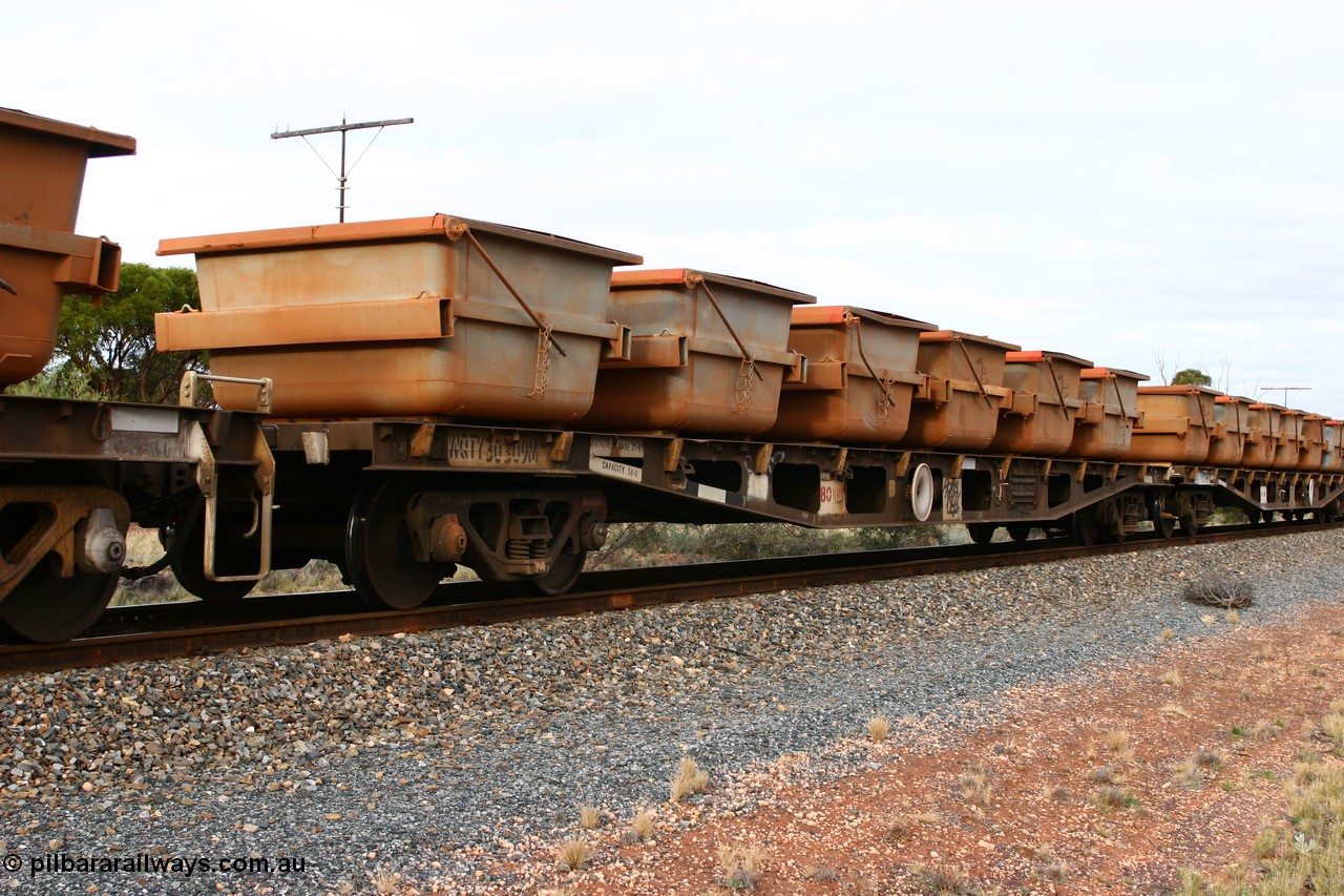 060527 4136
Scotia, WQTY 30309 flat waggon, originally built by Tomlinson Steel WA as WFX type in 1969 from a batch of one hundred and sixty one waggons, recoded to WQCX type in 1980, then WQC type before recoded back the WQCX in 1981, then to RQHX in 1994, to current code in 1996. Seen here carrying six loaded nickel ore kibbles.
Keywords: WQTY-type;WQTY30309;Tomlinson-Steel-WA;WFX-type;WQCX-type;WQC-type;RQHX-type;