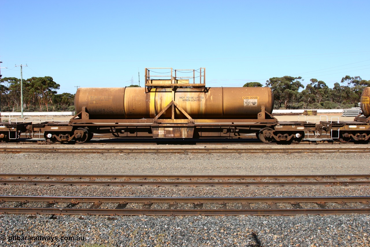 060528 4414
West Kalgoorlie, AQHY 30038 with sulphuric acid tank CSA 0012, originally built by the WAGR Midland Workshops in 1964/66 as a WF type flat waggon, then in 1997, following several recodes and modifications, was one of seventy five waggons converted to the WQH type to carry CSA sulphuric acid tanks between Hampton/Kalgoorlie and Perth/Kwinana.
Keywords: AQHY-type;AQHY30038;WAGR-Midland-WS;WF-type;WFP-type;WFDY-type;WFDF-type;RFDF-type;WQH-type;