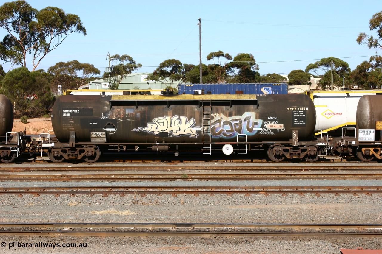 060528 4514
West Kalgoorlie, WTEY 7317 diesel fuel tank waggon, former NTAF in service for BP Oil, former AMPOL tank, coded WTEY when arrived in WA.
Keywords: WTEY-type;WTEY7317;NTAF-type;