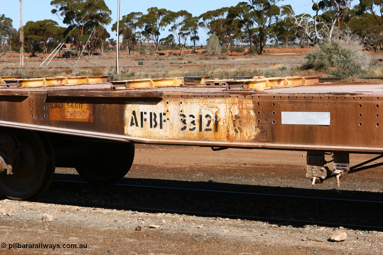 060530 4945
Parkeston, AFBF 33121 kibble flat waggon, built by WAGR Midland Workshops in 1969 in a batch of fifty eight WGX type open waggons without end doors, in 1975 to WGN for nickel traffic, back to WGX in 1976, to WOAX, then in 1987 to WOSF for steel traffic, then further cut down to for kibble traffic as seen here.
Keywords: AFBF-type;AFBF33121;WAGR-Midland-WS;WGX-type;WGN-type;WOAX-type;WOSF-type;