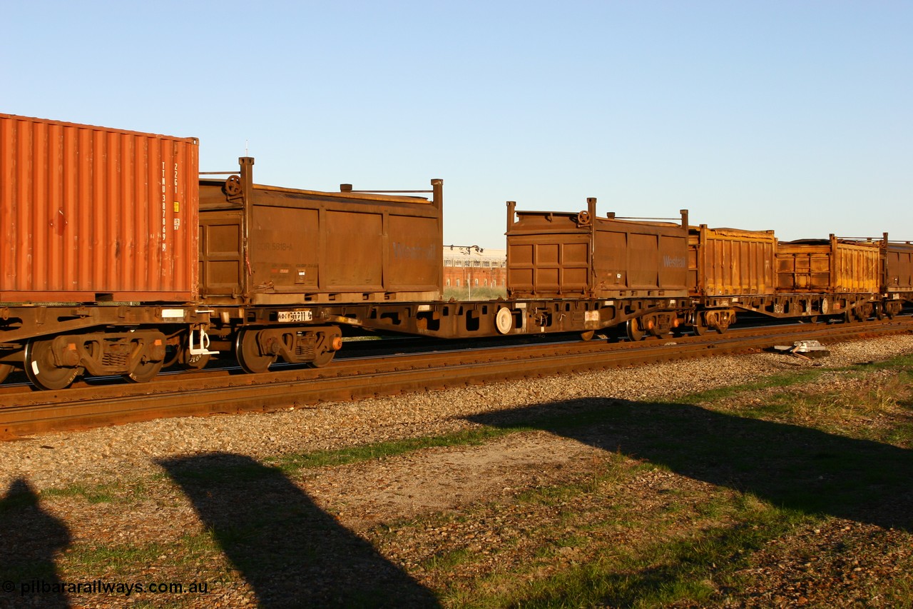 060603 5248
Midland, AQCY 30211 container flat waggon, built by WAGR Midland Workshops in 1974 as a batch of forty five WFX type container flats. Recoded to WQCX in 1980 loaded with two 20' roll top containers Westrail COR type COR 5818 and COR 5154.
Keywords: AQCY-type;AQCY30211;WAGR-Midland-WS;WFX-type;WQCX-type;