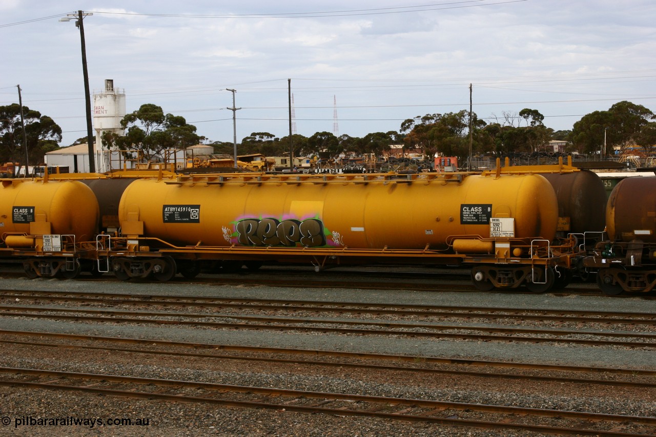 070526 9053
West Kalgoorlie, ATBY 14591 fuel tank waggon built by Westrail Midland Workshops in a batch of nine in 1981 for Bain Leasing Pty Ltd as type JPB, 82,000 litres but 14591 was issued to standard gauge as WJPB type, in 1985 it was converted to narrow gauge as JPBA type.
Keywords: ATBY-type;ATBY14591;Westrail-Midland-WS;WJPB-type;JPBA-type;