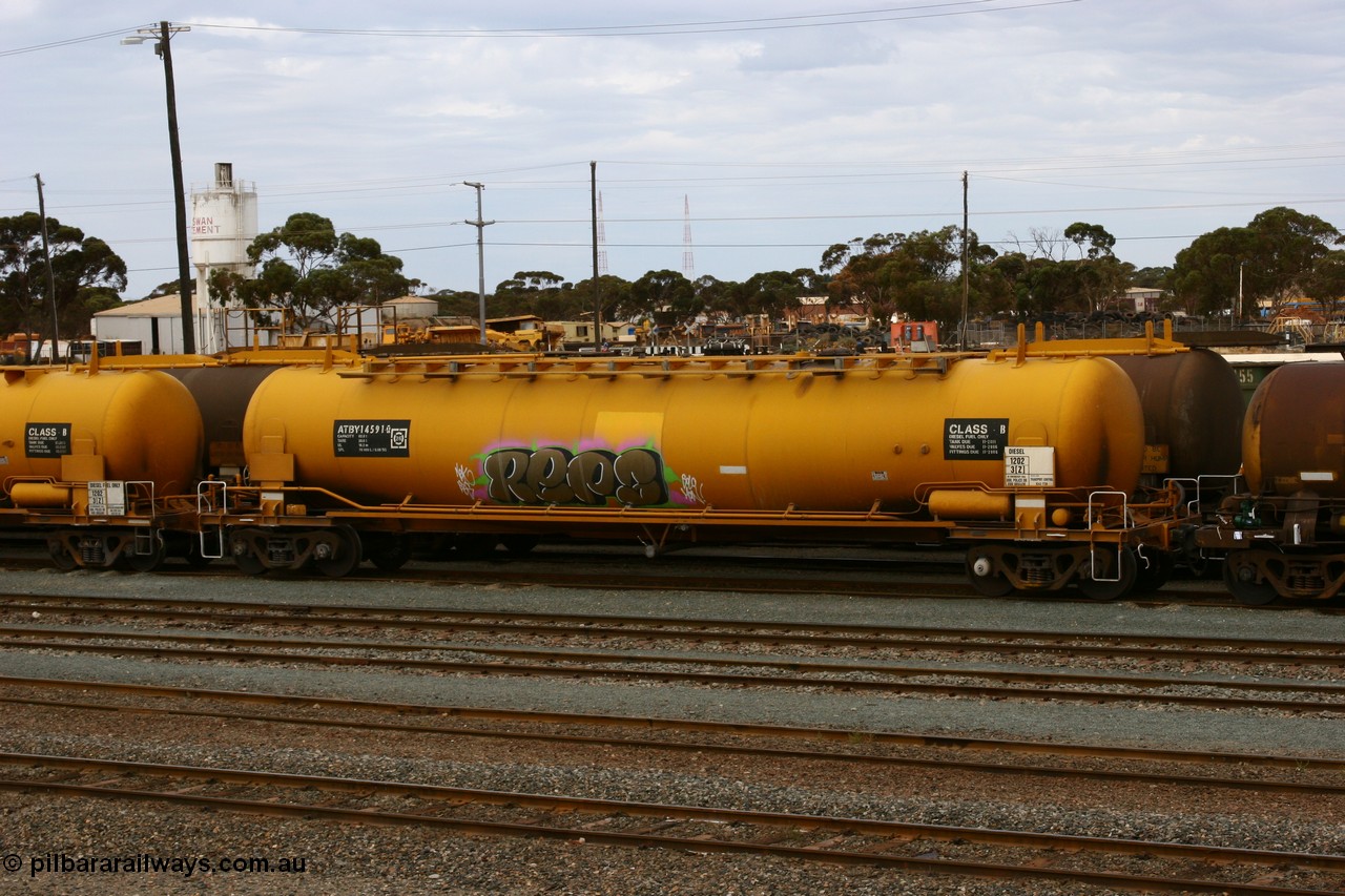 070526 9053
West Kalgoorlie, ATBY 14591 fuel tank waggon built by Westrail Midland Workshops in a batch of nine in 1981 for Bain Leasing Pty Ltd as type JPB, 82,000 litres but 14591 was issued to standard gauge as WJPB type, in 1985 it was converted to narrow gauge as JPBA type.
Keywords: ATBY-type;ATBY14591;Westrail-Midland-WS;JPB-type;WJPB-type;JPBA-type;