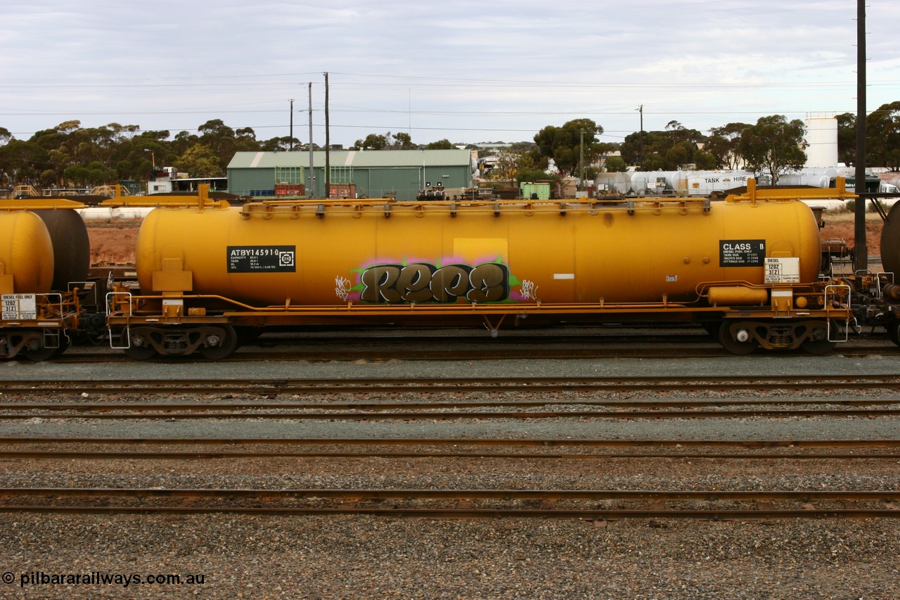 070526 9054
West Kalgoorlie, ATBY 14591 fuel tank waggon built by Westrail Midland Workshops in a batch of nine in 1981 for Bain Leasing Pty Ltd as type JPB, 82,000 litres but 14591 was issued to standard gauge as WJPB type, in 1985 it was converted to narrow gauge as JPBA type.
Keywords: ATBY-type;ATBY14591;Westrail-Midland-WS;JPB-type;WJPB-type;JPBA-type;