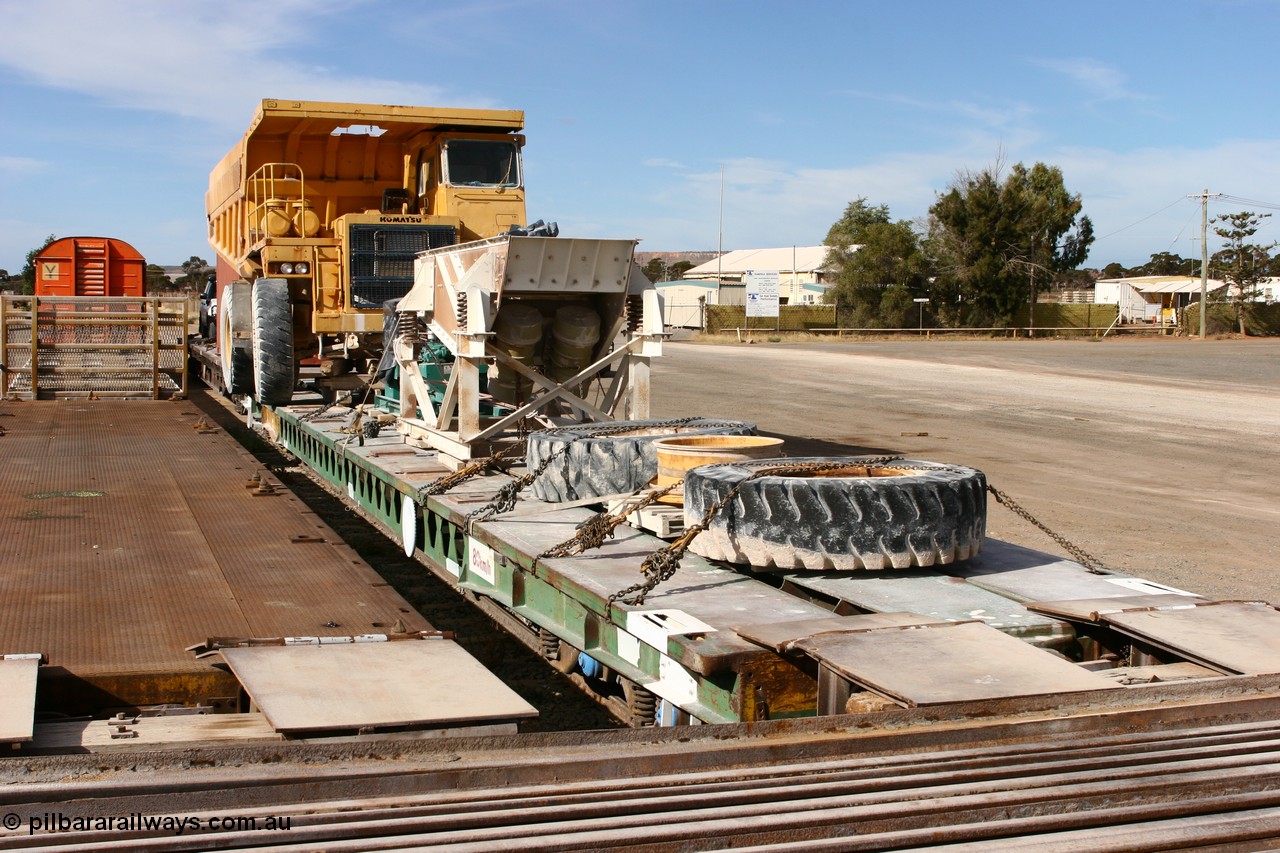 070527 9174
Parkeston, AZQF 1966 heavy weight waggon, originally built by Commonwealth Railways Port Augusta Workshops in November 1966, issued as 1966, coded Q, then later to AZQF, fitted with narrow gauge rails on deck for conveyance of rollingstock between Port Augusta and Marree. Seen here in use with ARG loaded with Loongana Limestone equipment. 
Keywords: AZQF-type;AZQF1966;CR-Port-Augusta-WS;Q-type;