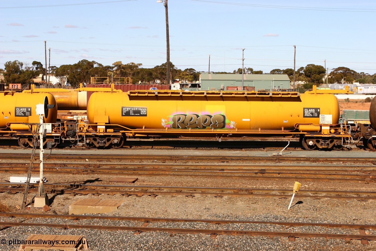 070529 9413
West Kalgoorlie, ATBY 14591 fuel tank waggon built by Westrail Midland Workshops in a batch of nine in 1981 for Bain Leasing Pty Ltd as type JPB, 82,000 litres but 14591 was issued to standard gauge as WJPB type, in 1985 it was converted to narrow gauge as JPBA type.
Keywords: ATBY-type;ATBY14591;Westrail-Midland-WS;JPB-type;WJPB-type;JPBA-type;