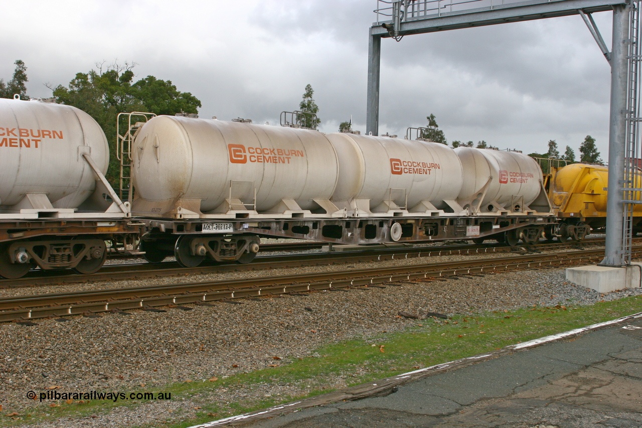 070608 0093
Midland, AQCY 30212 container waggon, originally one of forty five built by WAGR Midland Workshops in 1974 as WFX type, to WQCX in 1981, carrying three Cockburn Cement pressurised cement - lime tanktainers.
Keywords: AQCY-type;AQCY30212;WAGR-Midland-WS;WFX-type;WQCX-type;