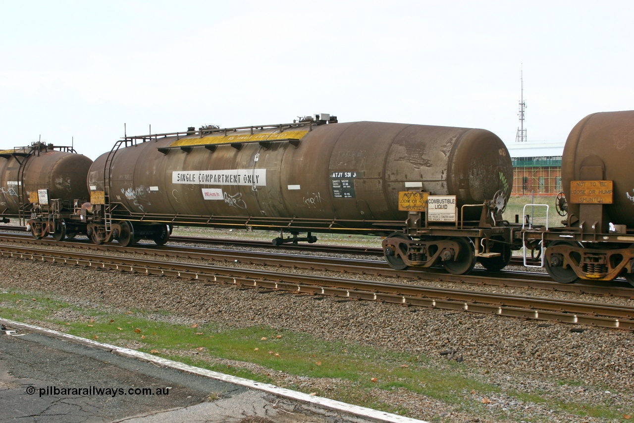 070608 0113
Midland, ATJY 531 fuel tank waggon built by Comeng NSW in 1971 for AMPOL, the same as a sister tank built at the same time for Caltex both as WJJ type two compartment two dome. Seen here in service with Caltex. 91,000 litres now single compartment.
Keywords: ATJY-type;ATJY531;Comeng-WA;WJJ-type;