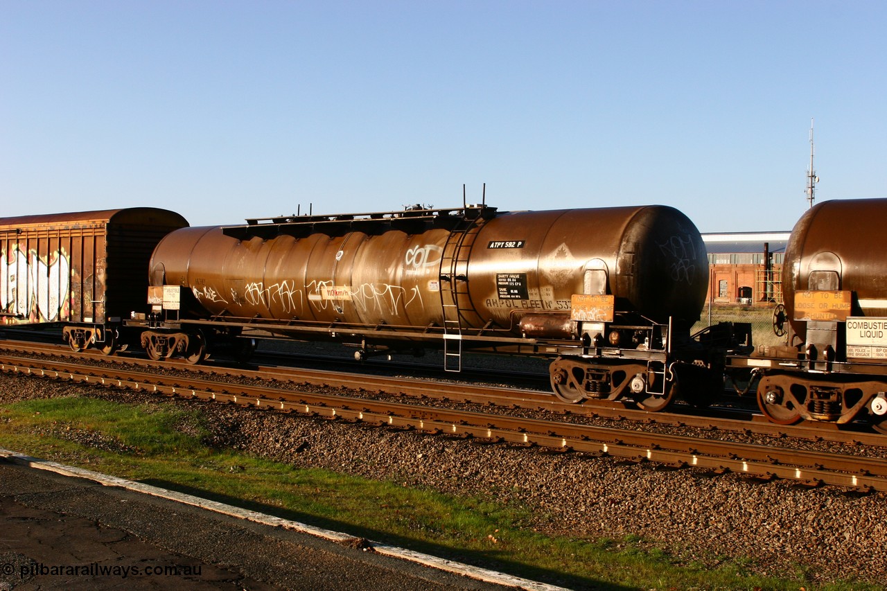 070609 0201
Midland, ATPY 592 fuel tank waggon built by WAGR Midland Workshops in 1976 as one of four WJP type for AMPOL, capacity of 80500 litres, here in Caltex service.
Keywords: ATPY-type;ATPY592;WAGR-Midland-WS;WJP-type;