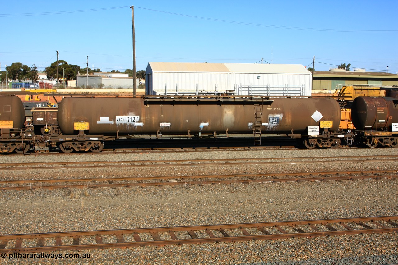 100602 8668
West Kalgoorlie, ATQF 612 diesel fuel tanker, Shell Fleet No. TR721, one of two such waggons built by Indeng Qld in 1982 for Shell as type WJQ with an original capacity of 79000 litres, current diesel capacity of 72000 litres, fitted with type F InterLock couplers.
Keywords: ATQF-type;ATQF612;Indeng-Qld;WJQ-type;