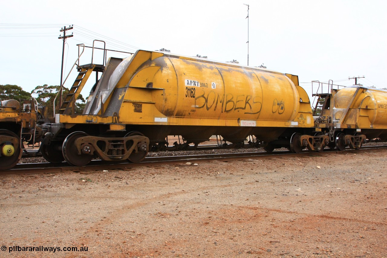 100605 9114
Parkeston, APNY 31162, final one of twelve built by WAGR Midland Workshops in 1974 as WNA type pneumatic discharge nickel concentrate waggon, WAGR built and owned copies of the AE Goodwin built WN waggons for WMC.
Keywords: APNY-type;APNY31162;WAGR-Midland-WS;WNA-type;