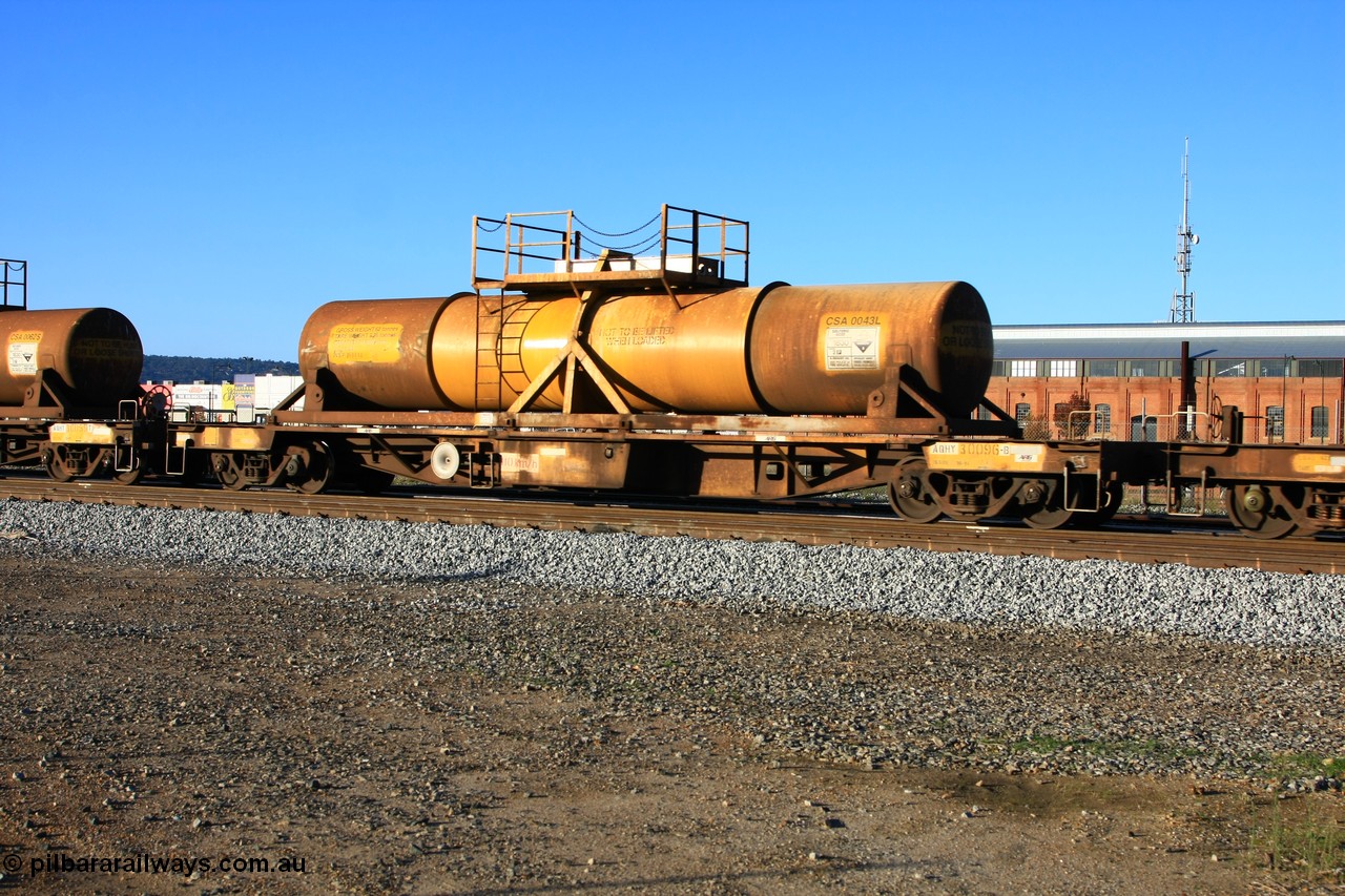 100609 09932
Midland, AQHY 30096 with sulphuric acid tank CSA 0043, originally built by the WAGR Midland Workshops in 1964/66 as a WF type flat waggon, then in 1997, following several recodes and modifications, was one of seventy five waggons converted to the WQH type to carry CSA sulphuric acid tanks between Hampton/Kalgoorlie and Perth/Kwinana.
Keywords: AQHY-type;AQHY30096;WAGR-Midland-WS;WF-type;WFDY-type;WFDF-type;RFDF-type;WQH-type;