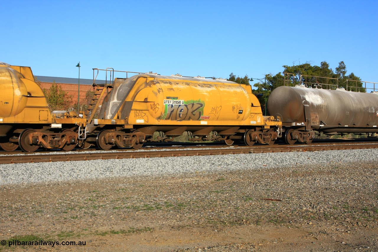 100609 09960
Midland, APNY 31158 one of twelve built by WAGR Midland Workshops in 1974 as WNA type pneumatic discharge nickel concentrate waggon, WAGR built and owned copies of the AE Goodwin built WN waggons for WMC.
Keywords: APNY-type;APNY31158;WAGR-Midland-WS;WNA-type;