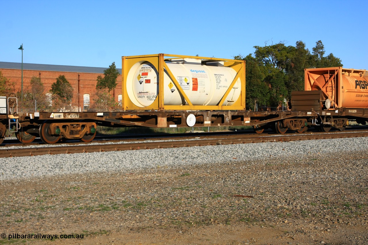 100609 09990
Midland, AQWY 30435 container waggon originally one of one hundred and sixty one built by Tomlinson Steel in 1970 as WFX type, to WQCX in 1980. Loaded with a 20' Degussa 2075 type tanktainer DWAU 933152 for hydrogen peroxide.
Keywords: AQWY-type;AQWY30435;Tomlinson-Steel-WA;WFX-type;WQCX-type;