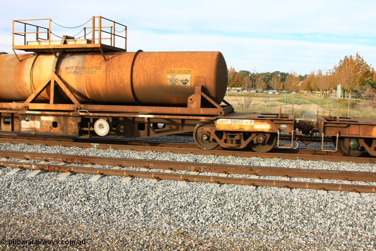 100611 0314
Midland, AQHY 30060 with sulphuric acid tank CSA 0032, originally built by the WAGR Midland Workshops in 1964/66 at WF type flat waggons, then following several codes and modifications in 1997 seventy five were converted to WQH to carry CSA sulphuric acid tanks between Hampton/Kalgoorlie and Perth/Kwinana.
Keywords: AQHY-type;AQHY30060;WAGR-Midland-WS;WF-type;WFL-type;WFDY-type;WFDF-type;RFDF-type;WQH-type;