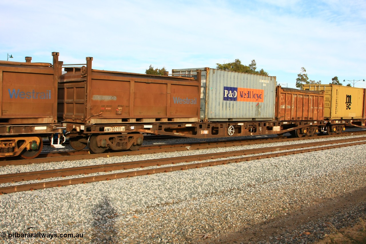 100611 0357
Midland, AQWY 30211 container flat waggon, built by WAGR Midland Workshops in 1974 as a batch of forty five WFX type container flats. Recoded to WQCX in 1980. Loaded here with a Westrail COR roll top container COR 5885, P+O Nedlloyd 22G1 20' box and open top COT 6807.
Keywords: AQWY-type;AQWY30211;WAGR-Midland-WS;WFX-type;WQCX-type;AQCY-type;