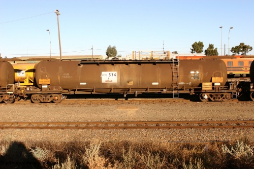 060528 4638 ATPF574K
West Kalgoorlie, ATPF 574 fuel tanker, one of nine built by WAGR Midland Workshops in 1974 for Shell as type WJP, 80.66 kL one compartment one dome, original code and fleet no. TR709, with a capacity now of 80000 litres.
Keywords: ATPF-type;ATPF574;WAGR-Midland-WS;WJP-type;