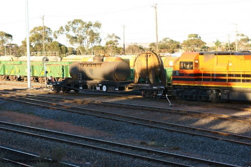 060528 4674
West Kalgoorlie, AZWY 30373 'Sputnik' loco oil and sand waggon, originally built as an WFX type flat waggon by Tomlinson Steel in a batch of one hundred and sixty one in 1969-70. Recoded to WQCX type in 1980 and to WSP type waste oil and sand waggon in 1986.
Keywords: AZWY-type;AZWY30373;Tomlinson-Steel-WA;WFX-type;WQCX-type;WSP-type;