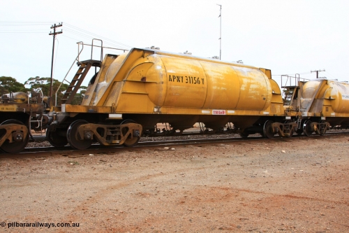 100605 9113
Parkeston, APNY 31156, one of twelve built by WAGR Midland Workshops in 1974 as WNA type pneumatic discharge nickel concentrate waggon, WAGR built and owned copies of the AE Goodwin built WN waggons for WMC.
Keywords: APNY-type;APNY31156;WAGR-Midland-WS;WNA-type;