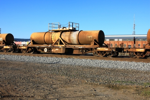 100609 09935
Midland, AQHY 30022 with sulphuric acid tank CSA 0011, originally built by the WAGR Midland Workshops in 1964/66 as a WF type flat waggon, then in 1997, following several recodes and modifications, was one of seventy five waggons converted to the WQH to carry CSA sulphuric acid tanks between Hampton/Kalgoorlie and Perth/Kwinana.
Keywords: AQHY-type;AQHY30022;WAGR-Midland-WS;WF-type;WMA-type;WFDY-type;WFDF-type;RFDF-type;WQH-type;
