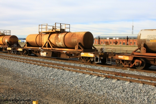 100611 0322
Midland, AQHY 30037 with sulphuric acid tank CSA 0060, originally built by the WAGR Midland Workshops in 1964/66 at WF type flat waggons, then following several codes and modifications in 1997 seventy five were converted to WQH to carry CSA sulphuric acid tanks between Hampton/Kalgoorlie and Perth/Kwinana.
Keywords: AQHY-type;AQHY30037;WAGR-Midland-WS;WF-type;WMA-type;WFDY-type;WFDF-type;RFDF-type;WQH-type;