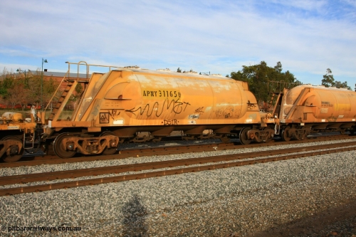 100611 0354
Midland, APNY 31165 one of four built by Westrail Midland Workshops in 1978 as WNA type pneumatic discharge nickel concentrate waggon, WAGR built and owned copies of the AE Goodwin built WN waggons for WMC.
Keywords: APNY-type;APNY31165;Westrail-Midland-WS;WNA-type;