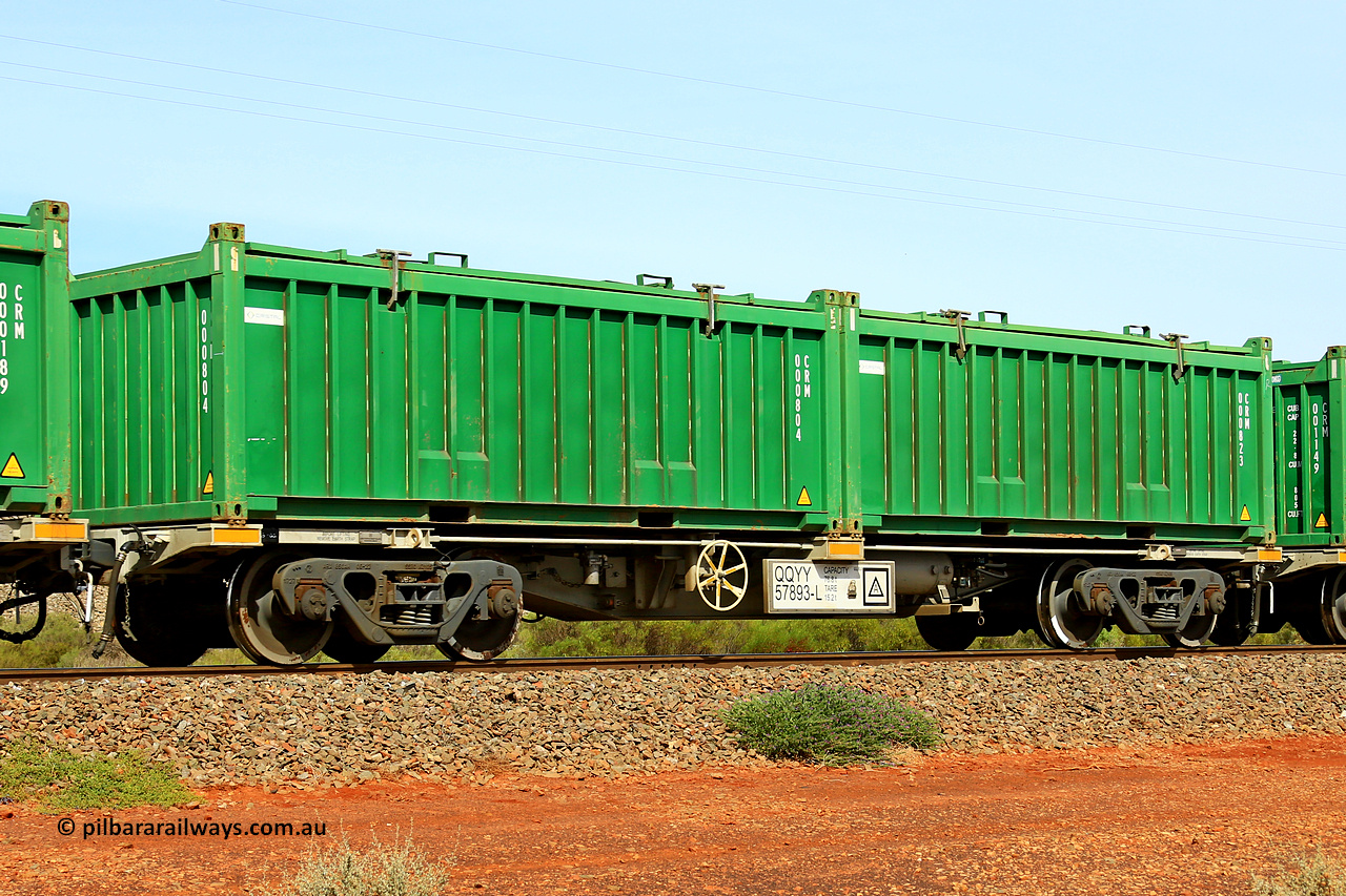231020 8155
Parkeston, QQYY type 40' container waggon QQYY 57893 one of five hundred ordered by Aurizon and built by CRRC Yangtze Group of China in 2022. In service with two loaded 20' half height hard top 'rotainers' lettered CRM, for Cristal Mining before they were absorbed into Tronox, CRM 000823 with Cristal decal and CRM 000804 with Cristal decal, on Aurizon's Tronox mineral sands train 4UP1 from Ivanhoe / Broken Hill (NSW) to Kwinana (WA). 20th of October 2023.
Keywords: QQYY-type;QQYY57893;CRRC-Yangtze-Group-China;