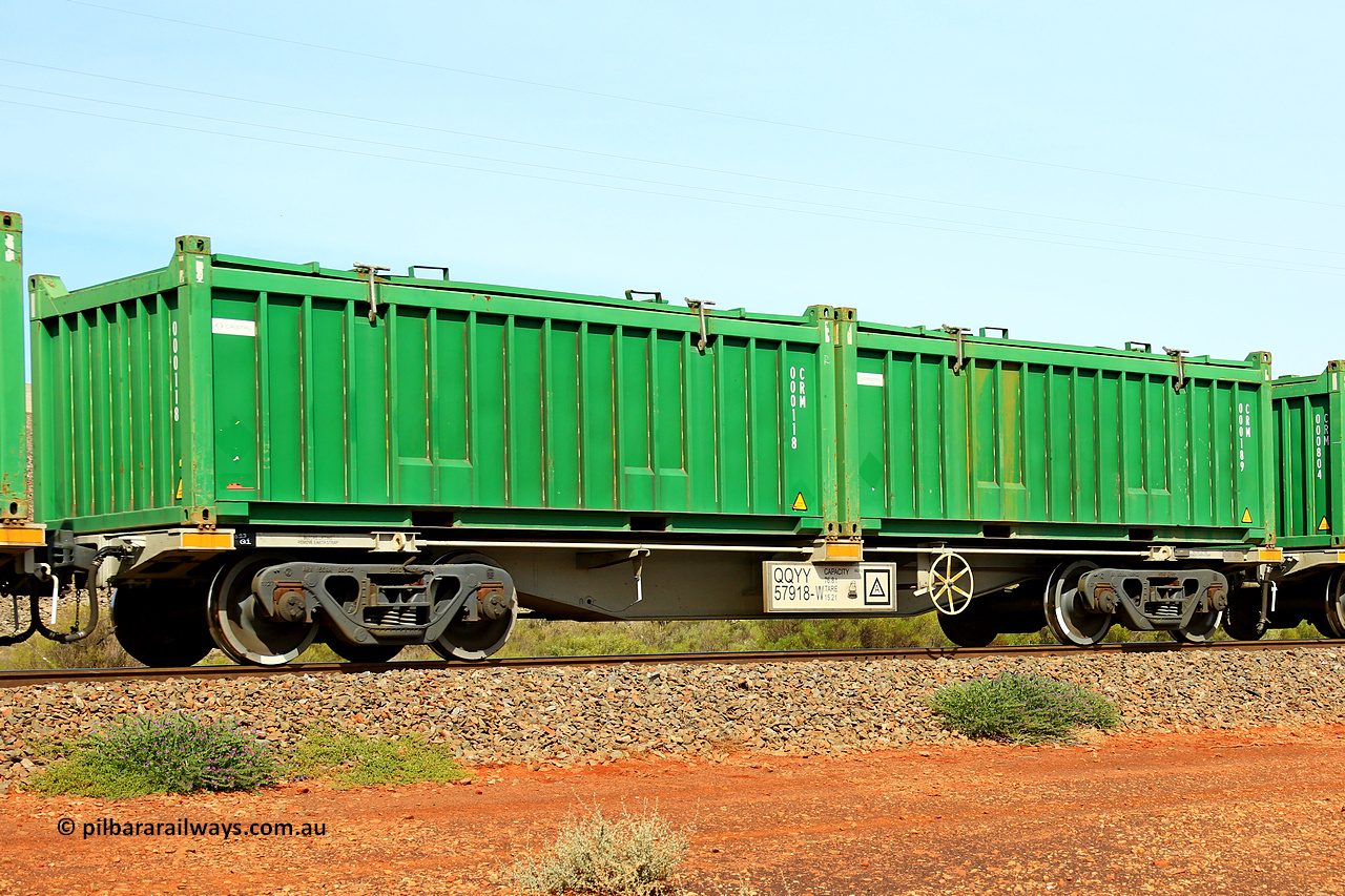231020 8156
Parkeston, QQYY type 40' container waggon QQYY 57918 one of five hundred ordered by Aurizon and built by CRRC Yangtze Group of China in 2022. In service with two loaded 20' half height hard top 'rotainers' lettered CRM, for Cristal Mining before they were absorbed into Tronox, CRM 000189 with Cristal decal and CRM 000118 with Cristal decal, on Aurizon's Tronox mineral sands train 4UP1 from Ivanhoe / Broken Hill (NSW) to Kwinana (WA). 20th of October 2023.
Keywords: QQYY-type;QQYY57918;CRRC-Yangtze-Group-China;