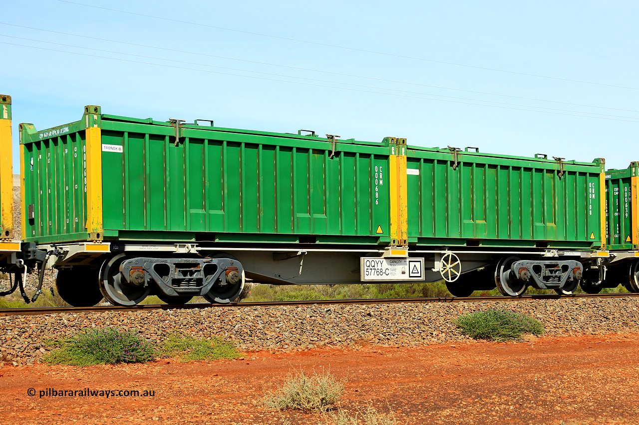 231020 8170
Parkeston, QQYY type 40' container waggon QQYY 57768 one of five hundred ordered by Aurizon and built by CRRC Yangtze Group of China in 2022. In service with two loaded 20' half height hard top 'rotainers' lettered CRM, for Cristal Mining before they were absorbed into Tronox, CRM 000108 with Cristal decal and yellow corner posts and CRM 000686 with Tronox decal and yellow corner posts, on Aurizon's Tronox mineral sands train 4UP1 from Ivanhoe / Broken Hill (NSW) to Kwinana (WA). 20th of October 2023.
Keywords: QQYY-type;QQYY57768;CRRC-Yangtze-Group-China;