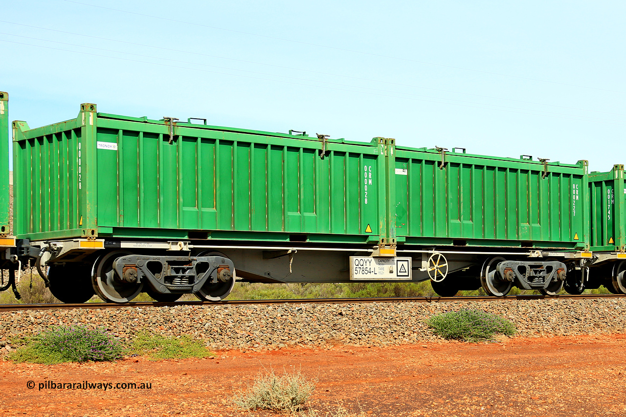 231020 8182
Parkeston, QQYY type 40' container waggon QQYY 57854 one of five hundred ordered by Aurizon and built by CRRC Yangtze Group of China in 2022. In service with two loaded 20' half height hard top 'rotainers' lettered CRM, for Cristal Mining before they were absorbed into Tronox, CRM 000227 with Cristal decal and CRM 000028 with Tronox decal, on Aurizon's Tronox mineral sands train 4UP1 from Ivanhoe / Broken Hill (NSW) to Kwinana (WA). 20th of October 2023.
Keywords: QQYY-type;QQYY57854;CRRC-Yangtze-Group-China;
