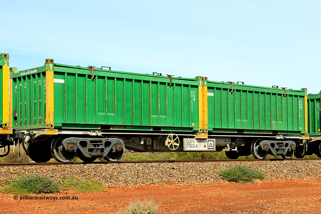 231020 8210
Parkeston, QQYY type 40' container waggon QQYY 57803 one of five hundred ordered by Aurizon and built by CRRC Yangtze Group of China in 2022. In service with two loaded 20' half height hard top 'rotainers' lettered CRM, for Cristal Mining before they were absorbed into Tronox, CRM 000578 with Tronox decal and yellow corner posts and CRM 001513 with Cristal decal and yellow corner posts, on Aurizon's Tronox mineral sands train 4UP1 from Ivanhoe / Broken Hill (NSW) to Kwinana (WA). 20th of October 2023.
Keywords: QQYY-type;QQYY57803;CRRC-Yangtze-Group-China;