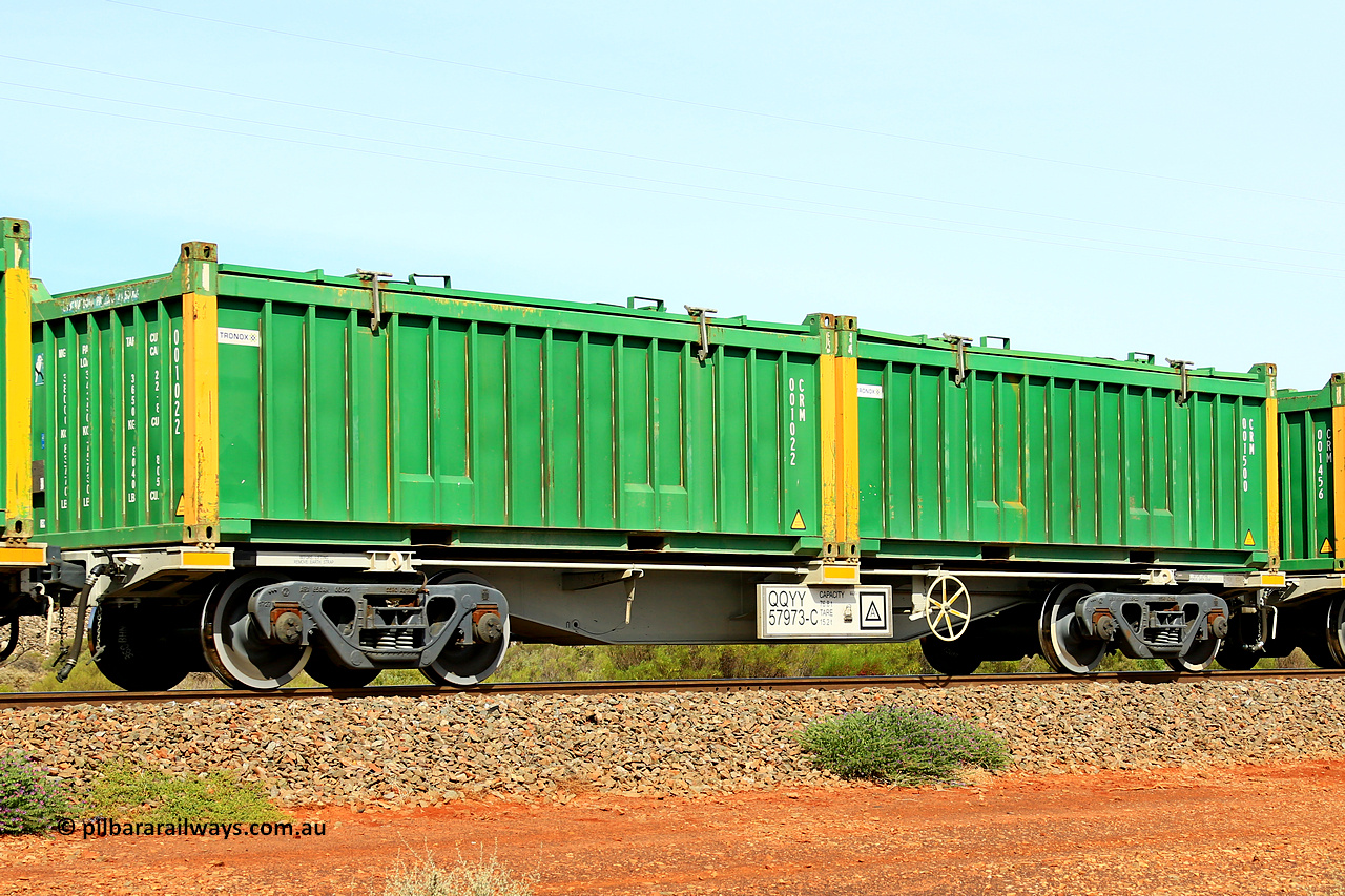 231020 8216
Parkeston, QQYY type 40' container waggon QQYY 57973 one of five hundred ordered by Aurizon and built by CRRC Yangtze Group of China in 2022. In service with two loaded 20' half height hard top 'rotainers' lettered CRM, for Cristal Mining before they were absorbed into Tronox, CRM 001500 with Tronox decal and yellow corner posts and CRM 001022 with Tronox decal and yellow corner posts, on Aurizon's Tronox mineral sands train 4UP1 from Ivanhoe / Broken Hill (NSW) to Kwinana (WA). 20th of October 2023.
Keywords: QQYY-type;QQYY57973;CRRC-Yangtze-Group-China;