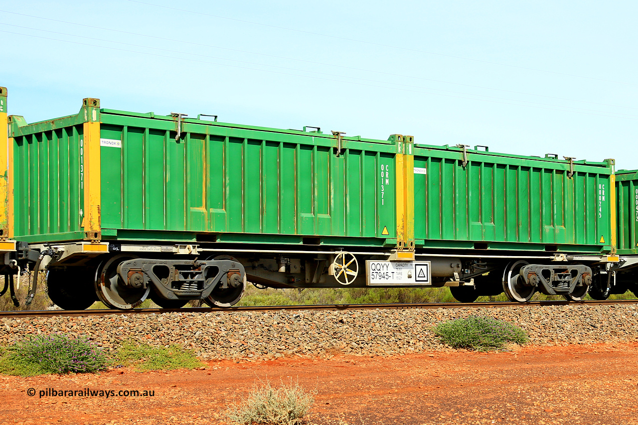 231020 8222
Parkeston, QQYY type 40' container waggon QQYY 57945 one of five hundred ordered by Aurizon and built by CRRC Yangtze Group of China in 2022. In service with two loaded 20' half height hard top 'rotainers' lettered CRM, for Cristal Mining before they were absorbed into Tronox, CRM 000245 with Tronox decal and yellow corner posts and CRM 001371 with Tronox decal and yellow corner posts, on Aurizon's Tronox mineral sands train 4UP1 from Ivanhoe / Broken Hill (NSW) to Kwinana (WA). 20th of October 2023.
Keywords: QQYY-type;QQYY57945;CRRC-Yangtze-Group-China;