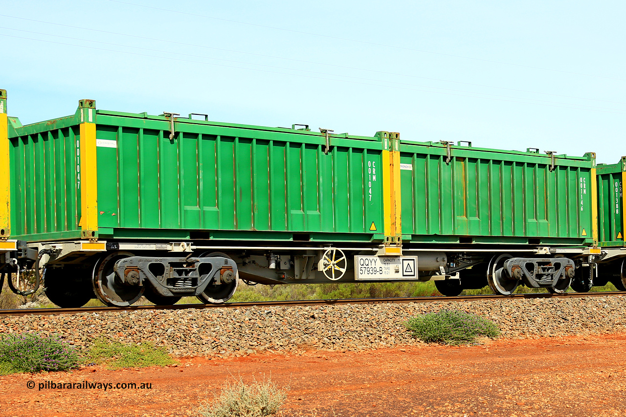 231020 8229
Parkeston, QQYY type 40' container waggon QQYY 57939 one of five hundred ordered by Aurizon and built by CRRC Yangtze Group of China in 2022. In service with two loaded 20' half height hard top 'rotainers' lettered CRM, for Cristal Mining before they were absorbed into Tronox, CRM 001146 with Tronox decal and yellow corner posts and CRM 001047 with Cristal decal and yellow corner posts, on Aurizon's Tronox mineral sands train 4UP1 from Ivanhoe / Broken Hill (NSW) to Kwinana (WA). 20th of October 2023.
Keywords: QQYY-type;QQYY57939;CRRC-Yangtze-Group-China;