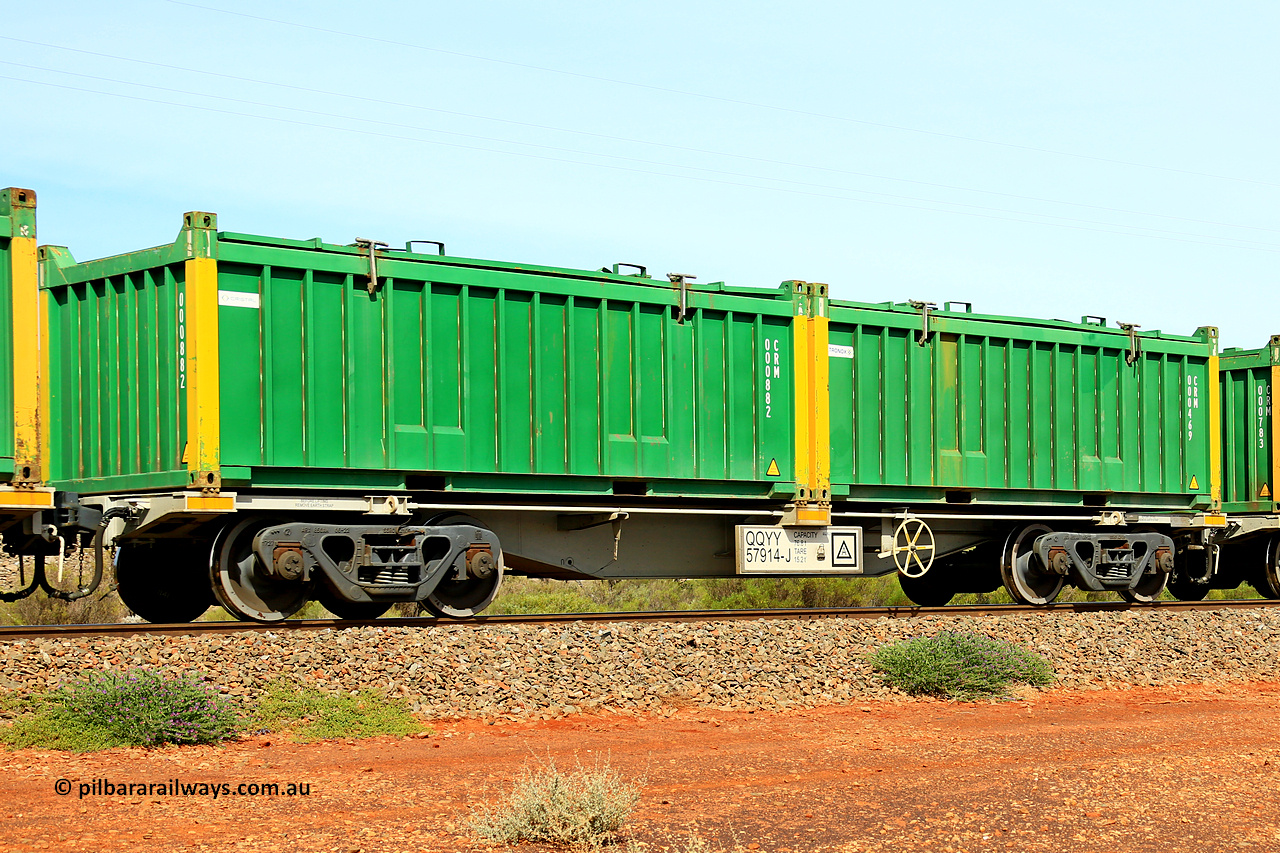 231020 8236
Parkeston, QQYY type 40' container waggon QQYY 57914 one of five hundred ordered by Aurizon and built by CRRC Yangtze Group of China in 2022. In service with two loaded 20' half height hard top 'rotainers' lettered CRM, for Cristal Mining before they were absorbed into Tronox, CRM 000469 with Tronox decal and yellow corner posts and CRM 000882 with Cristal decal and yellow corner posts, on Aurizon's Tronox mineral sands train 4UP1 from Ivanhoe / Broken Hill (NSW) to Kwinana (WA). 20th of October 2023.
Keywords: QQYY-type;QQYY57914;CRRC-Yangtze-Group-China;